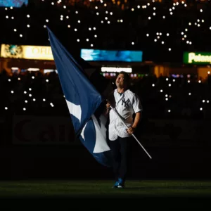 Nick Swisher holding a New York Yankees flag